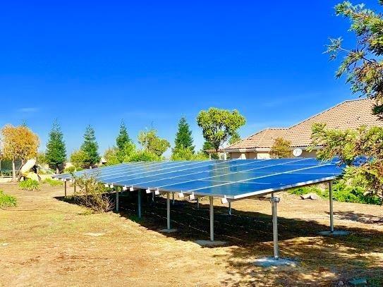 21196 Steward Road Madera, CA 93638 - Photo 13 of 39 a wooden bench sitting in the middle of a yard