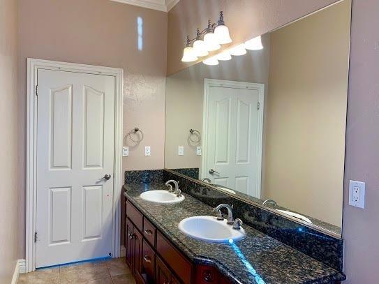 21196 Steward Road Madera, CA 93638 - Photo 32 of 39 a bathroom with a sink double vanity granite and a mirror