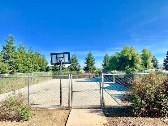 21196 Steward Road Madera, CA 93638 - Photo 33 of 39 a view of a lake with a house in the background