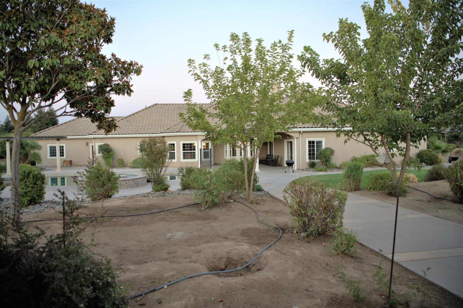 21196 Steward Road Madera, CA 93638 - Photo 38 of 39 a view of a house with a backyard