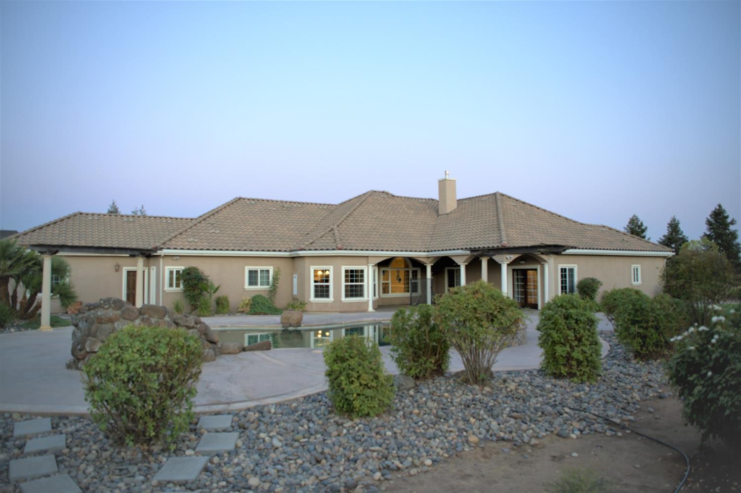 21196 Steward Road Madera, CA 93638 - Photo 39 of 39 a front view of a house with a yard