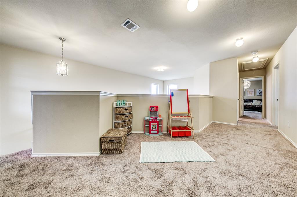 1774 Pioneer Way Lancaster, TX 75146 - Photo 16 of 23 a view of a room with gym equipment