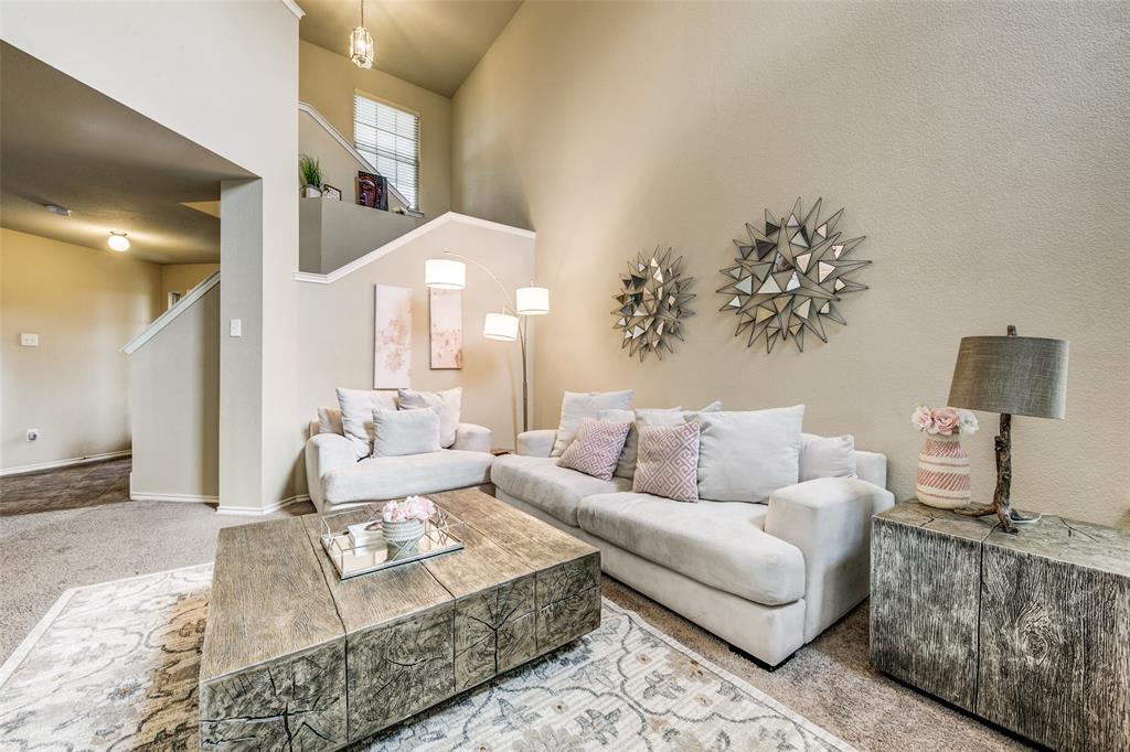 1774 Pioneer Way Lancaster, TX 75146 - Photo 2 of 23 a living room with furniture and a lamp