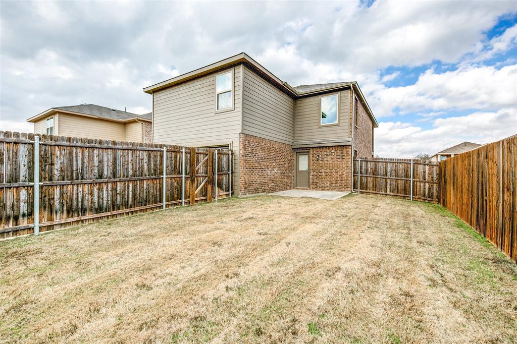 1774 Pioneer Way Lancaster, TX 75146 - Photo 21 of 23 a view of a house with wooden fence