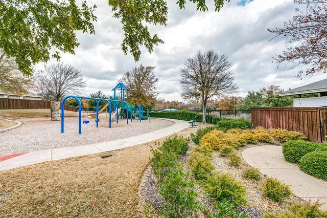 a view of a park with swings and slides
