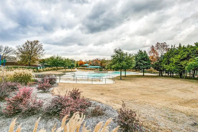 a view of a lake with a yard