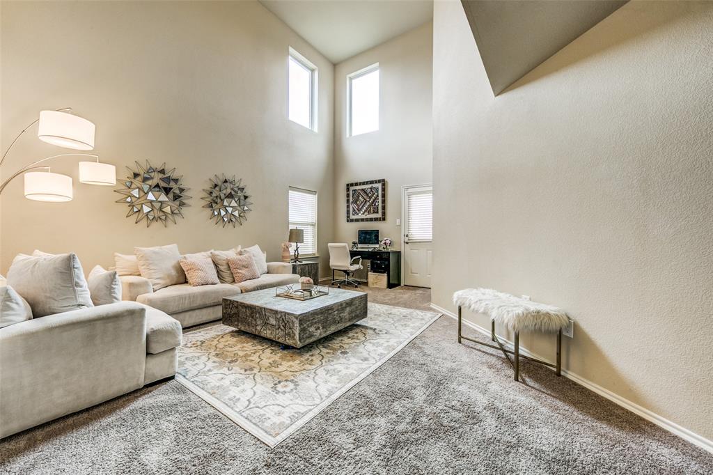 1774 Pioneer Way Lancaster, TX 75146 - Photo 3 of 23 a living room with furniture and a potted plant