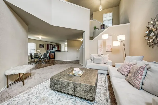 a living room with furniture and a table