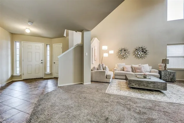 a living room with furniture and white walls