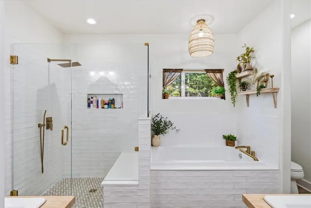 a bathroom with double vanity sink and a mirror