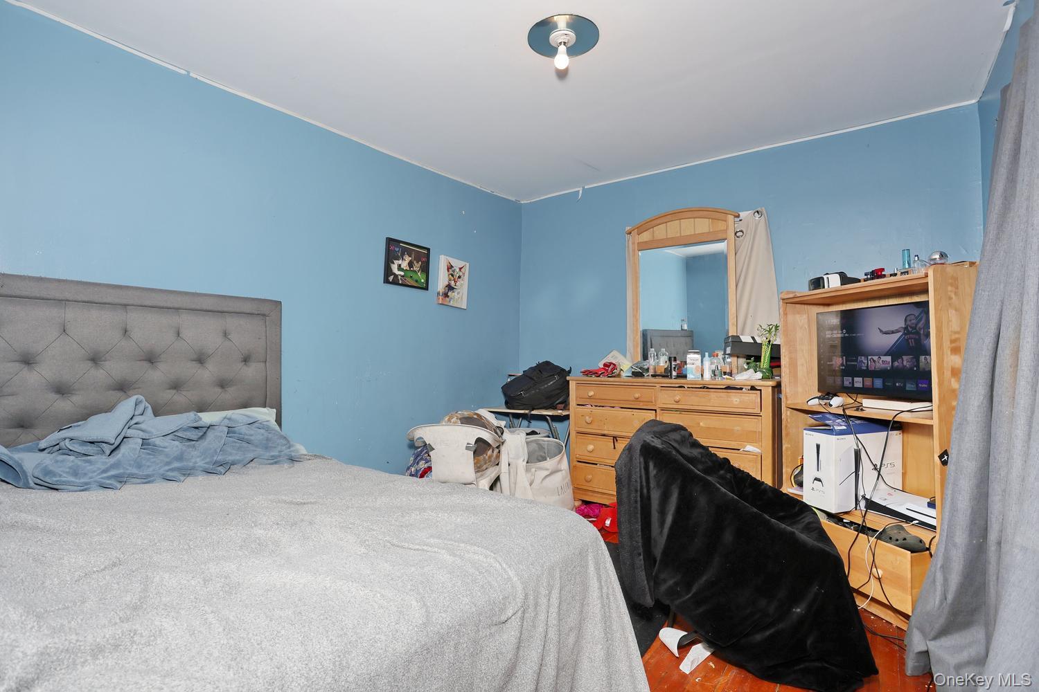 29 Fairview Avenue Spring Valley, NY 10977 - Photo 13 of 19 a bedroom with a bed and a flat screen tv