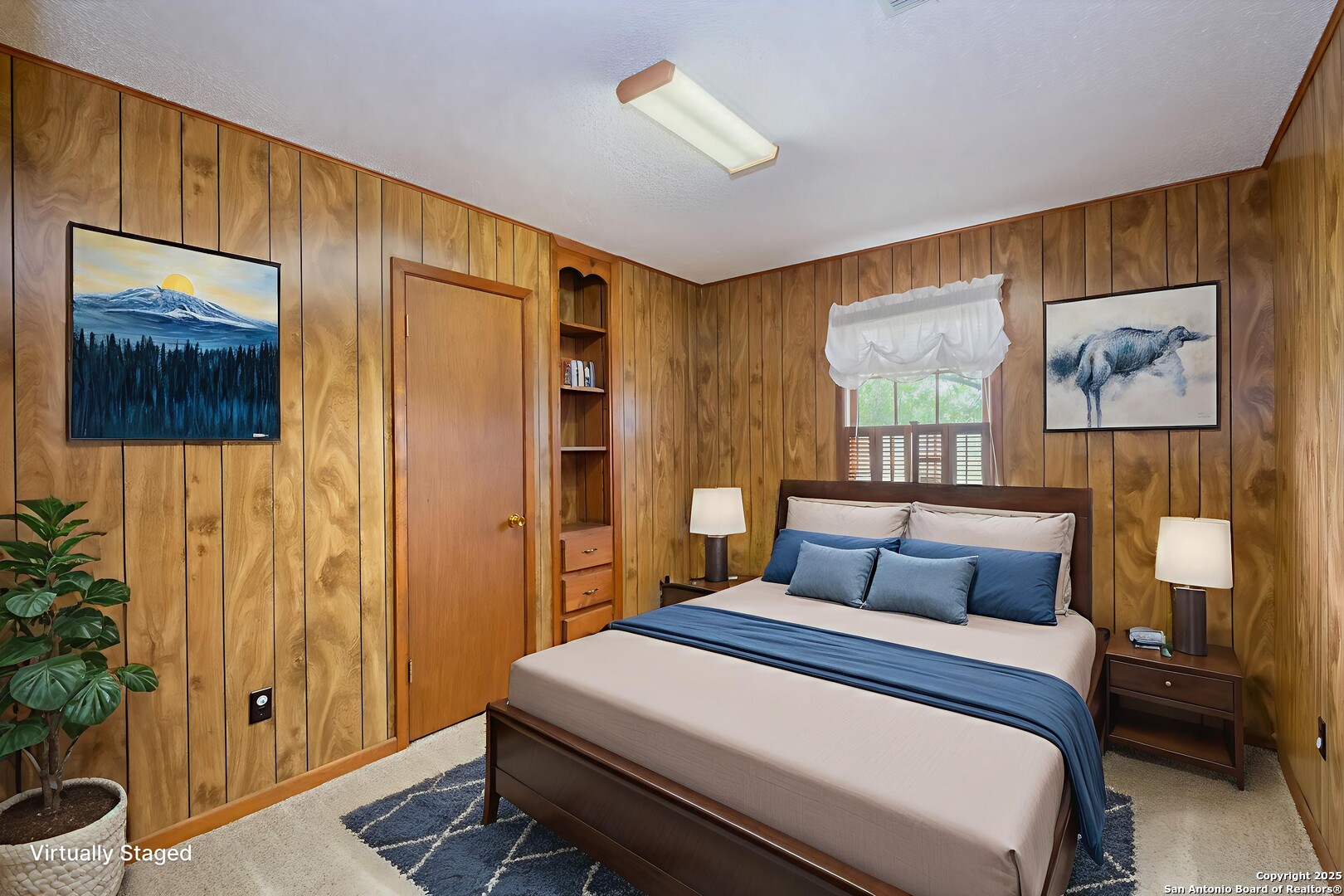 1221 Pieper Road New Braunfels, TX 78130 - Photo 22 of 43 a bedroom with a bed and a painting on the wall