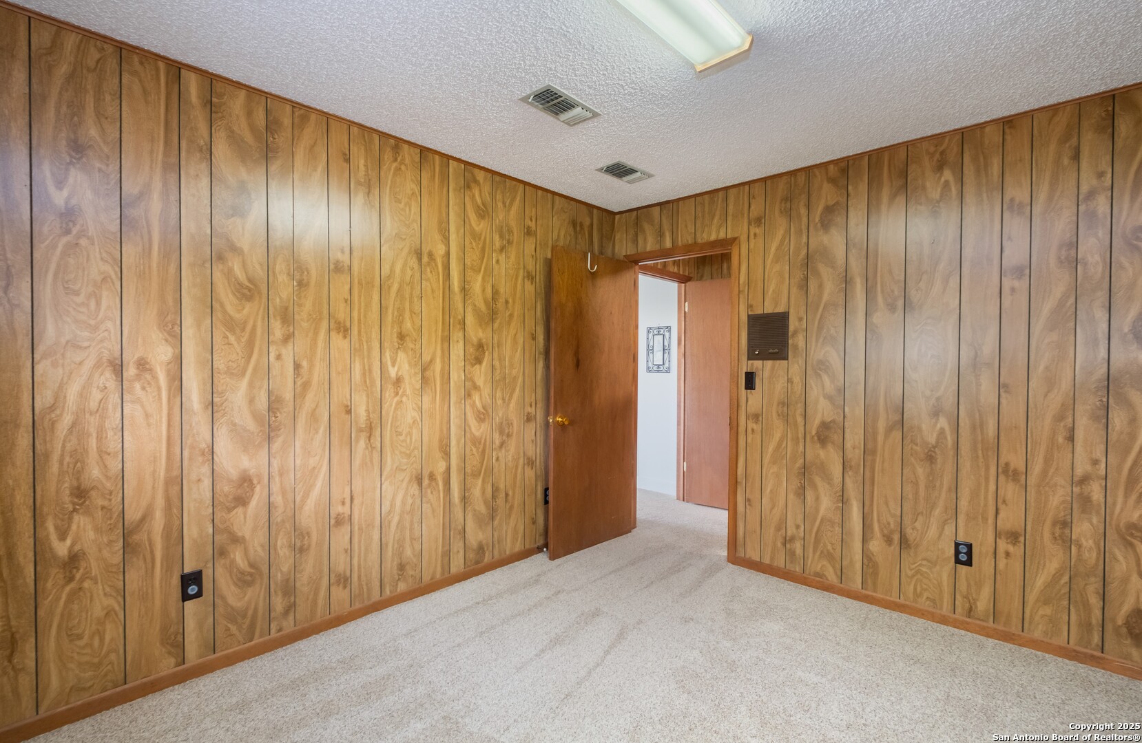 1221 Pieper Road New Braunfels, TX 78130 - Photo 23 of 43 a view of a elevator with wooden walls