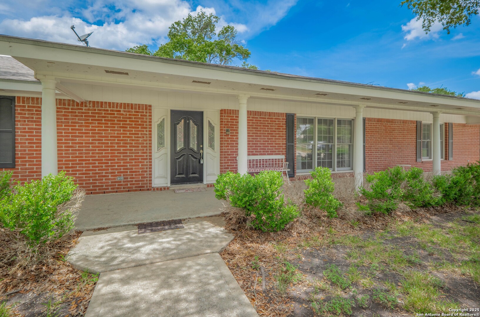 1221 Pieper Road New Braunfels, TX 78130 - Photo 3 of 43 a front view of a house with garden