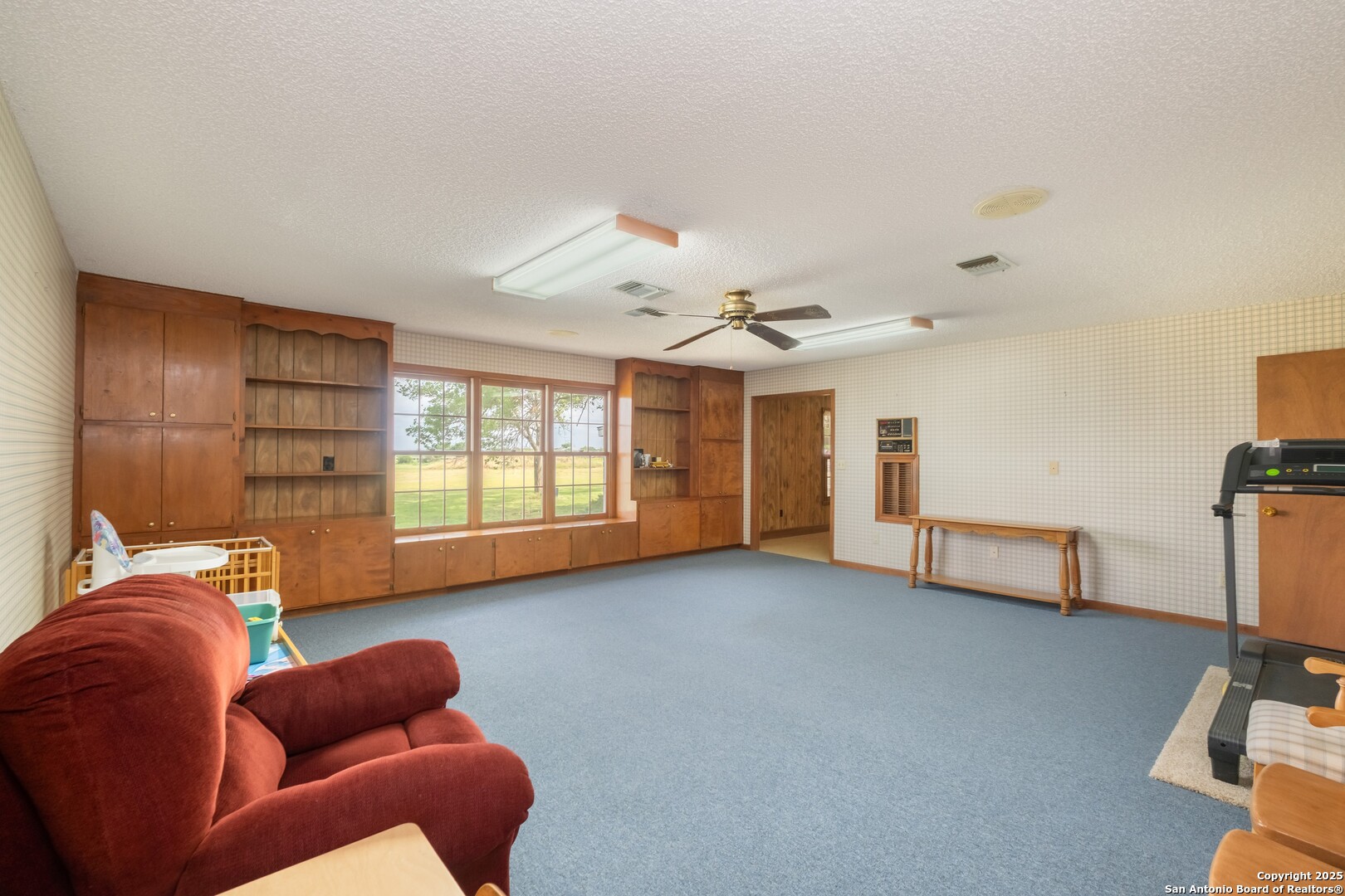1221 Pieper Road New Braunfels, TX 78130 - Photo 7 of 43 a bedroom with furniture and a large window