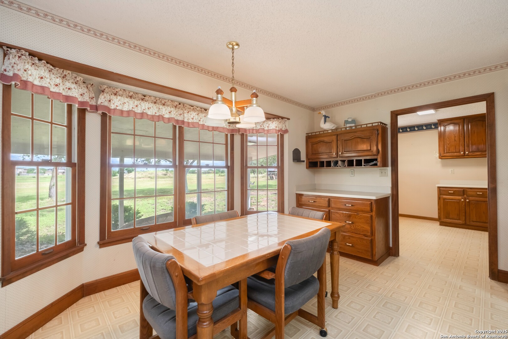 1221 Pieper Road New Braunfels, TX 78130 - Photo 9 of 43 a dining hall with stainless steel appliances granite countertop a stove and a dining table with the kitchen view
