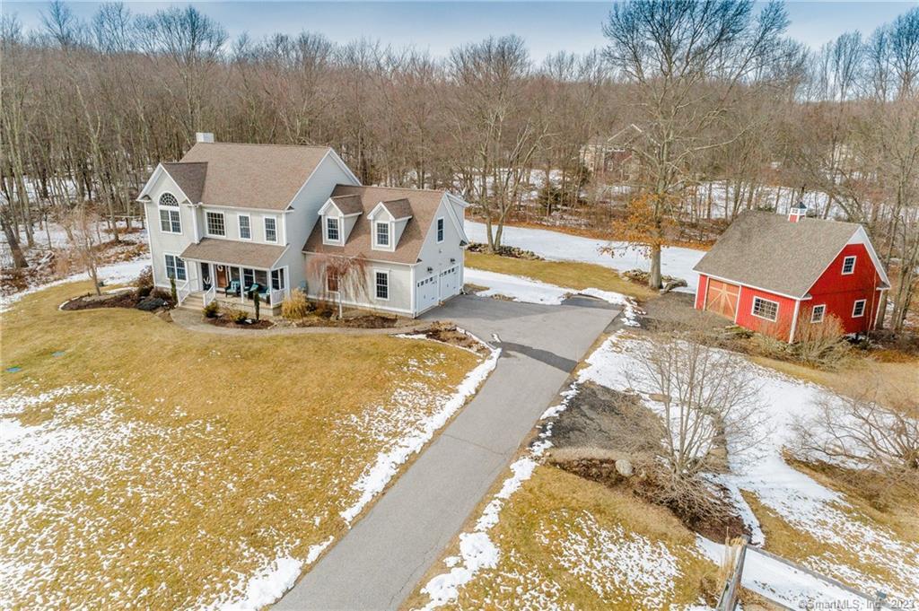 a view of residential houses with yard