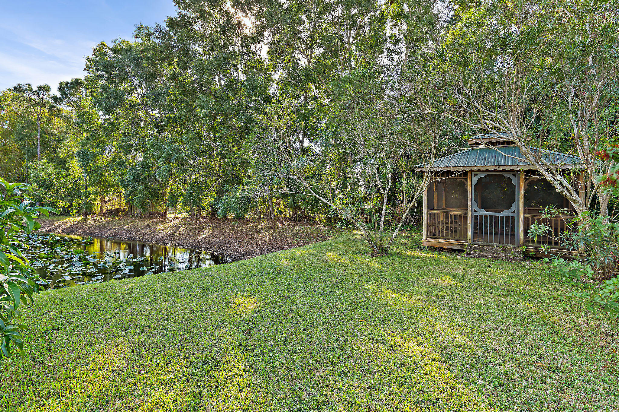 10344 154th Road North Jupiter, FL 33478 - Photo 33 of 50 Gazebo overlooking tranquil pond