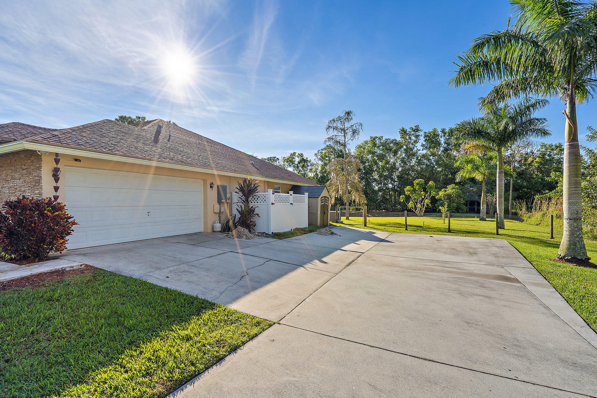 10344 154th Road North Jupiter, FL 33478 - Photo 40 of 50 Paved driveway with 2 car garage