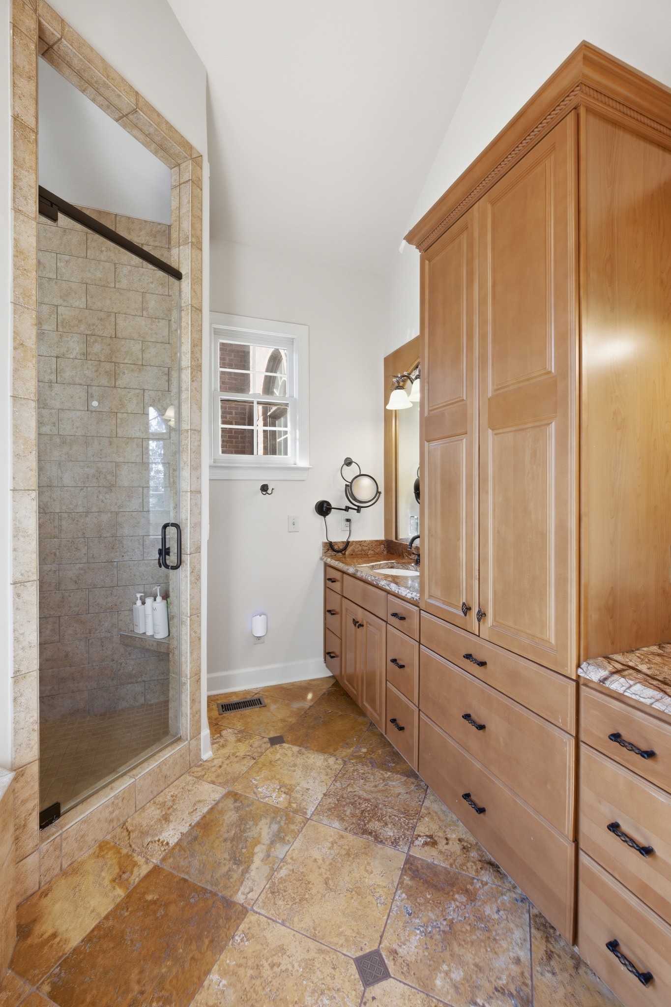 319 Hamlets End Way Franklin, TN 37067 - Photo 31 of 54 a bathroom with a granite countertop sink mirror and a shower