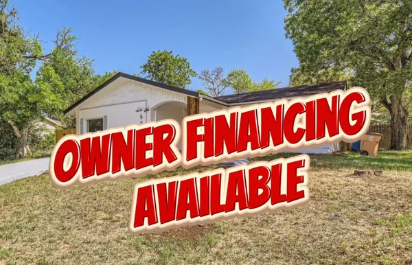 a street sign under a tree