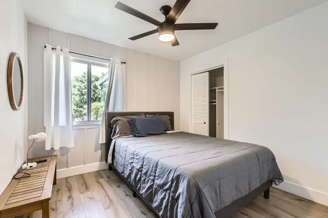 a bedroom with a bed and a window