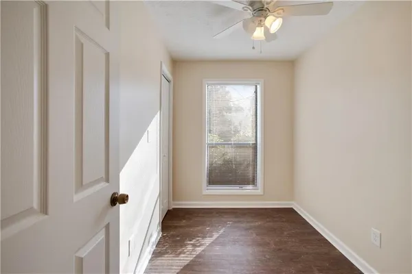 a kitchen with stainless steel appliances granite countertop a refrigerator a stove and a sink with wooden floor