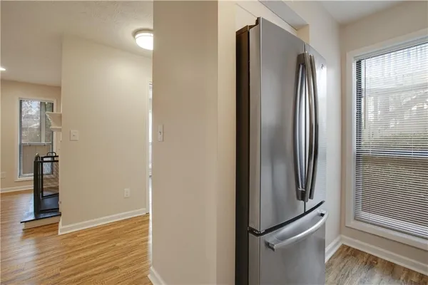 a kitchen with stainless steel appliances granite countertop a stove microwave and cabinets