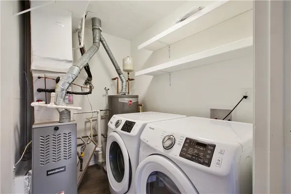 a utility room with dryer and washer