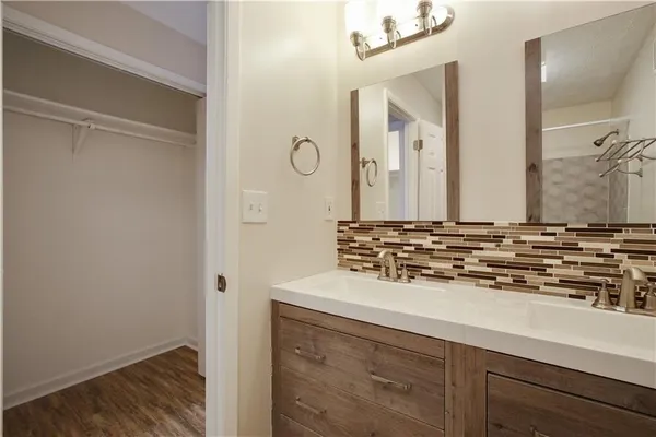 a white toilet sitting next to a bath tub and a shower