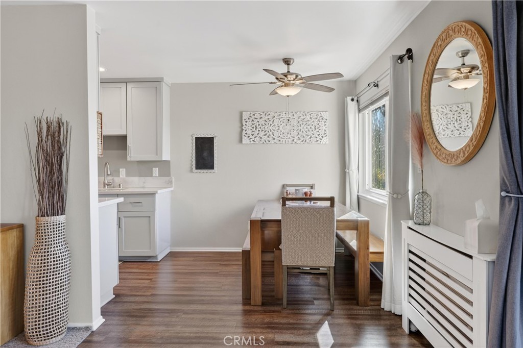 12200 Montecito Road, Unit B315 Seal Beach, CA 90740 - Photo 3 of 30 a view of a kitchen with fridge and wooden floor
