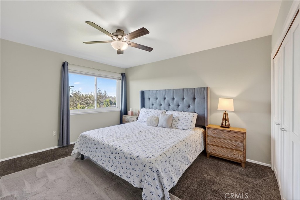 12200 Montecito Road, Unit B315 Seal Beach, CA 90740 - Photo 9 of 30 a bedroom with a large bed and a window