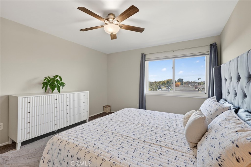 12200 Montecito Road, Unit B315 Seal Beach, CA 90740 - Photo 10 of 30 a bedroom with a bed dresser and a window