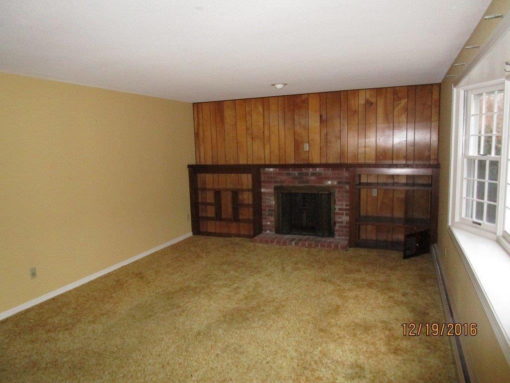 64 McNamara Road West Yarmouth, MA 02673 - Photo 2 of 14 an empty room with a empty space and windows