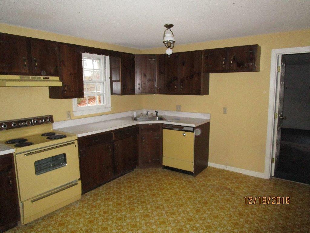 64 McNamara Road West Yarmouth, MA 02673 - Photo 4 of 14 a kitchen with a sink and a stove top oven