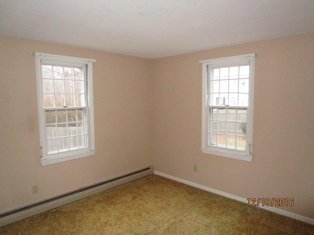 64 McNamara Road West Yarmouth, MA 02673 - Photo 9 of 14 an empty room with a window