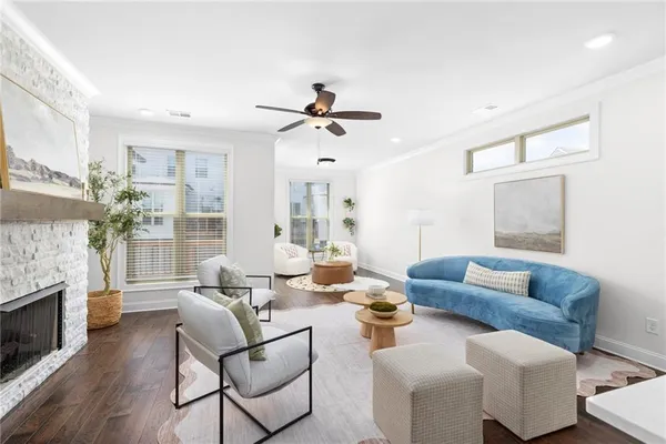 a living room with furniture fireplace and a chandelier
