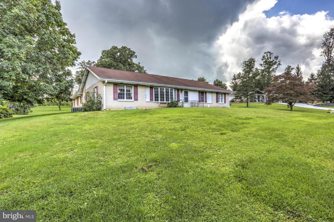 411 South Belmont Road Paradise, PA 17562 - Photo 2 of 25 a front view of a house with a garden
