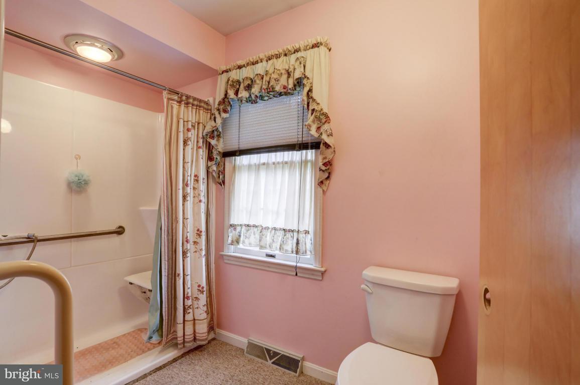 411 South Belmont Road Paradise, PA 17562 - Photo 19 of 25 a bathroom with a toilet sink tub and shower