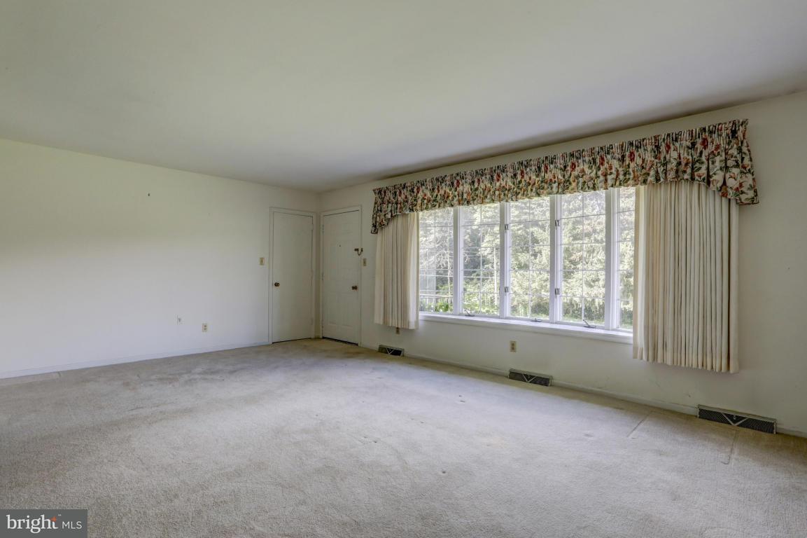 411 South Belmont Road Paradise, PA 17562 - Photo 3 of 25 an empty room with a window