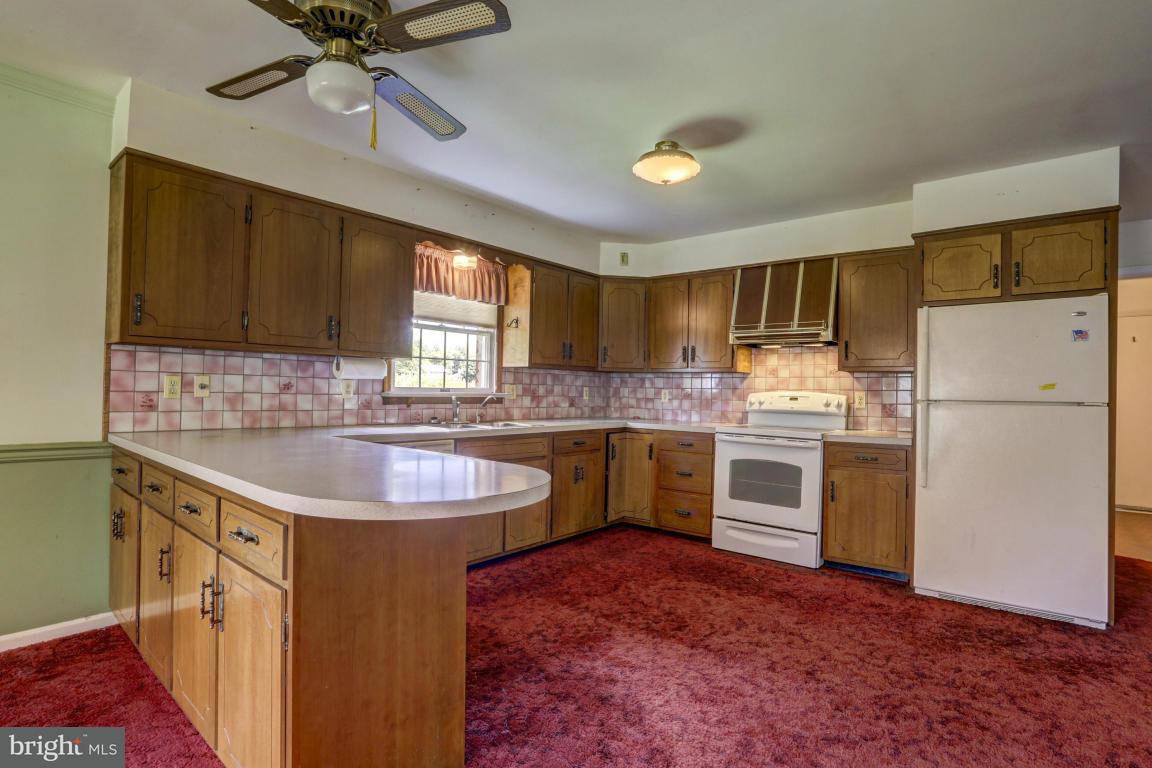 411 South Belmont Road Paradise, PA 17562 - Photo 7 of 25 a kitchen with a sink stove and refrigerator