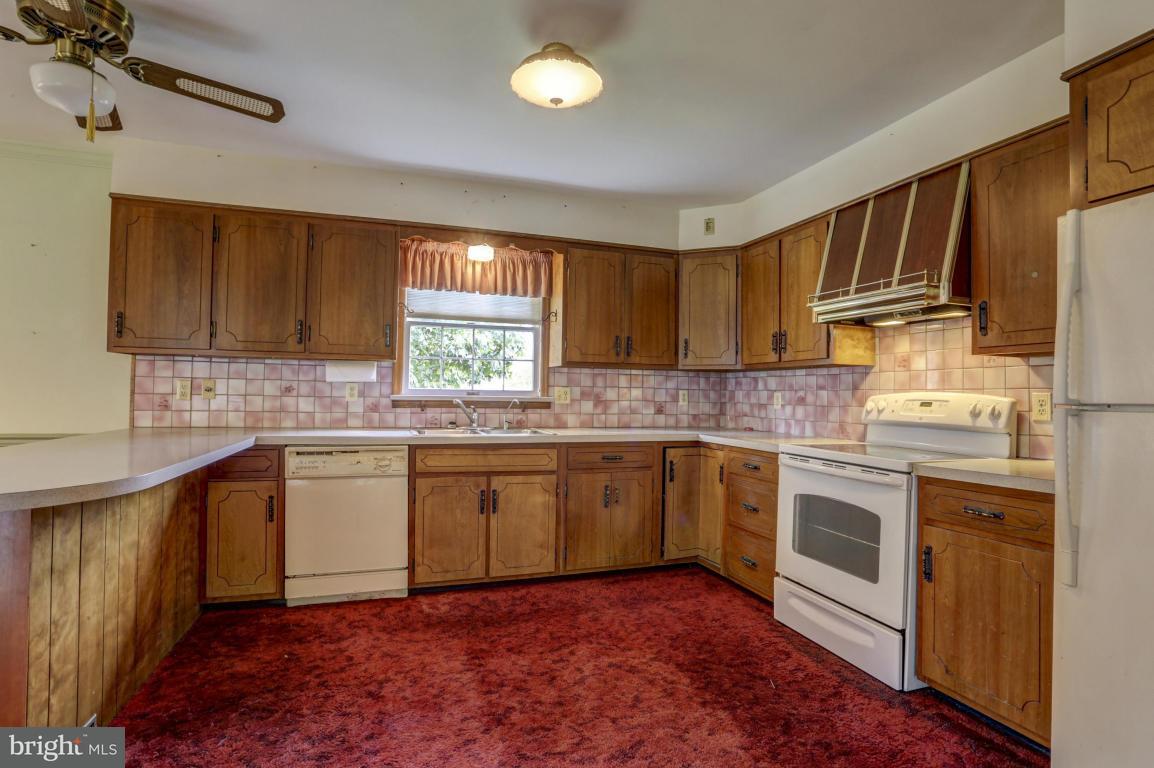 411 South Belmont Road Paradise, PA 17562 - Photo 8 of 25 a kitchen with granite countertop a sink stainless steel appliances and cabinets