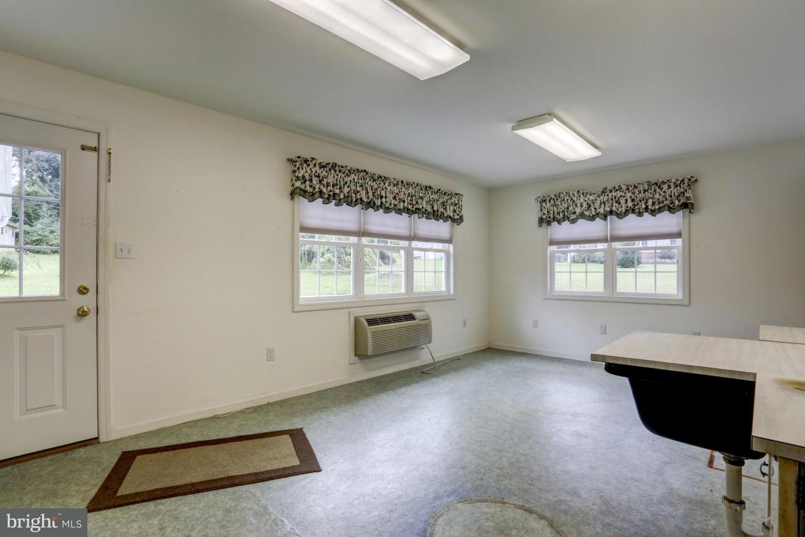 411 South Belmont Road Paradise, PA 17562 - Photo 10 of 25 a living room with furniture and a window