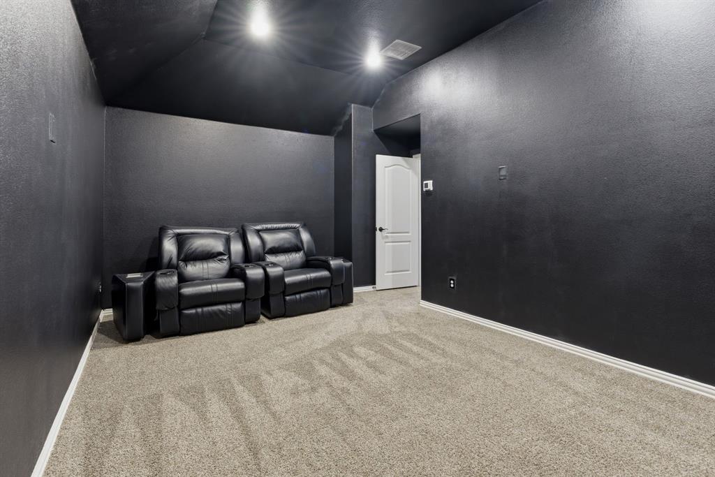 1316 Tree Shadow Lane Anna, TX 75409 - Photo 31 of 40 Media room upstairs tucked away at the end of the hallway. Escape to watch movies, sports or your favorite shows.