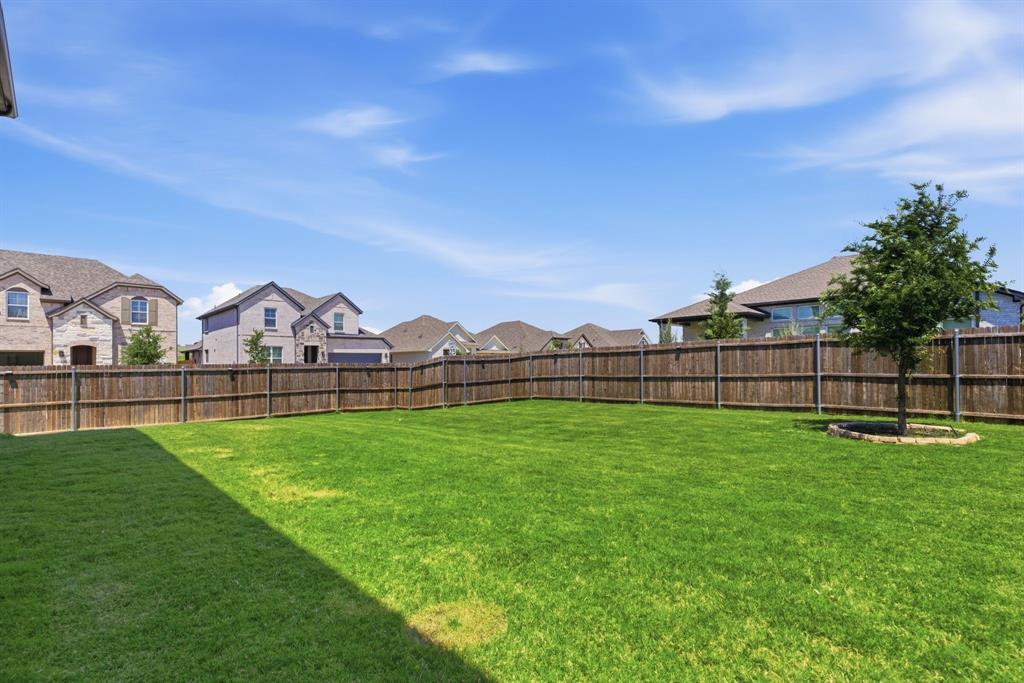 1316 Tree Shadow Lane Anna, TX 75409 - Photo 33 of 40 Backyard with plenty of space for fun! From here you can see the fireworks from the celebrations in Anna throughout the year.