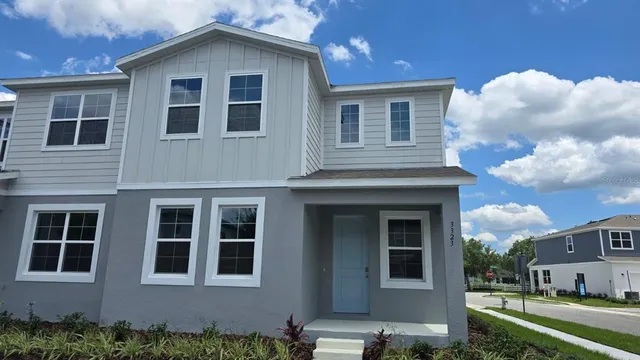 a view of a house with a yard
