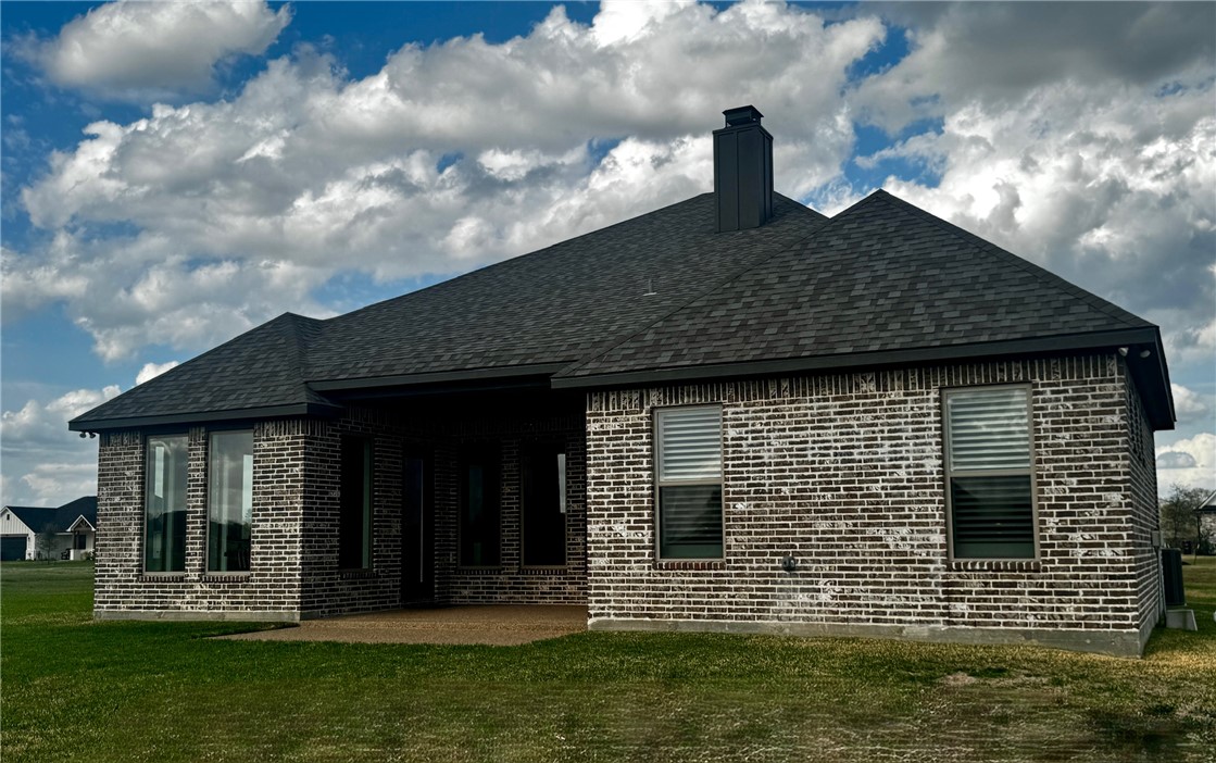 5854 Reliance Rdg Circle Bryan, TX 77808 - Photo 12 of 32 a view of a house with a yard