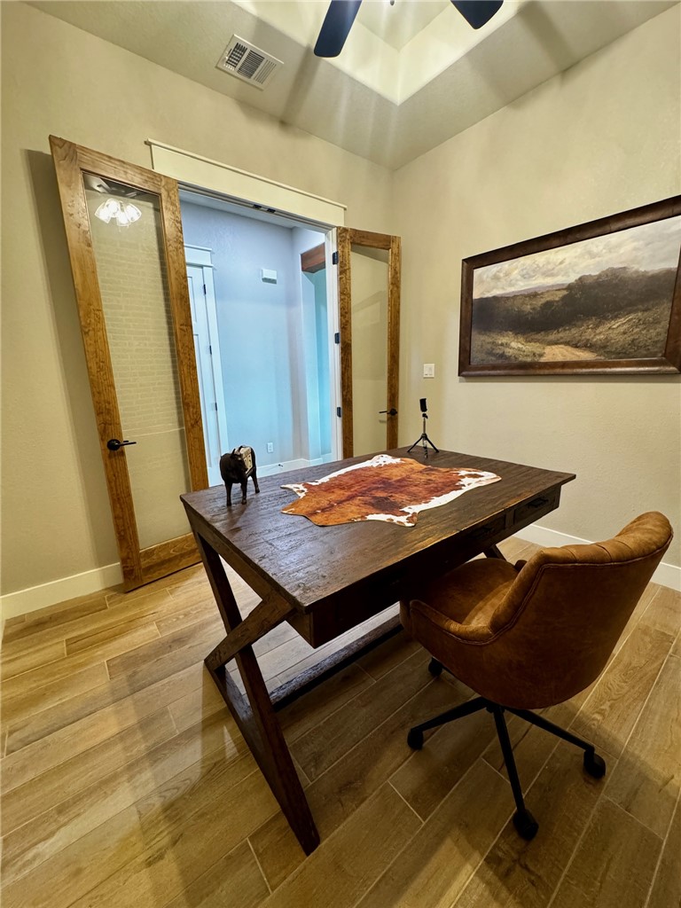 5854 Reliance Rdg Circle Bryan, TX 77808 - Photo 19 of 32 a view of a dining room with furniture and wooden floor