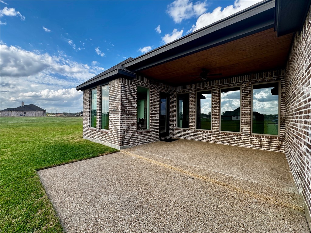 5854 Reliance Rdg Circle Bryan, TX 77808 - Photo 8 of 32 a view of a house with backyard and porch