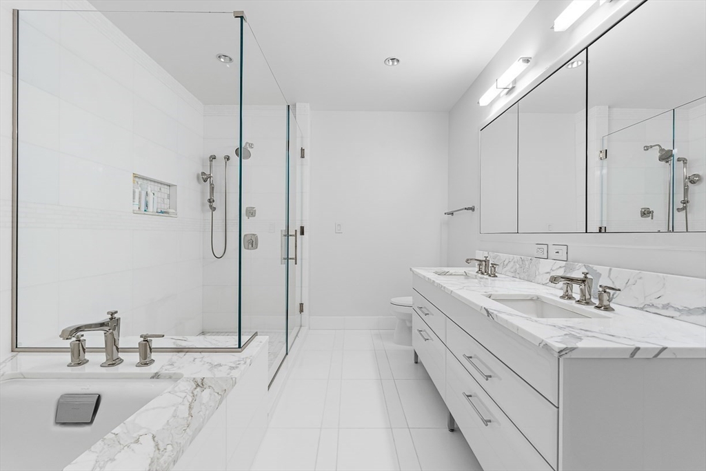 22 Liberty Drive, Unit 4D Boston, MA 02210 - Photo 13 of 21 a bathroom with a double vanity sink mirror and double